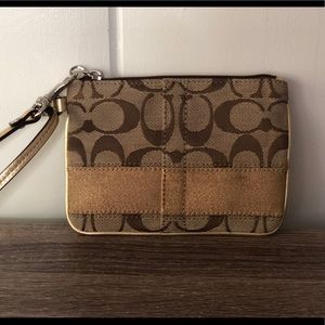 COACH signature logo tan and gold canvas wristlet